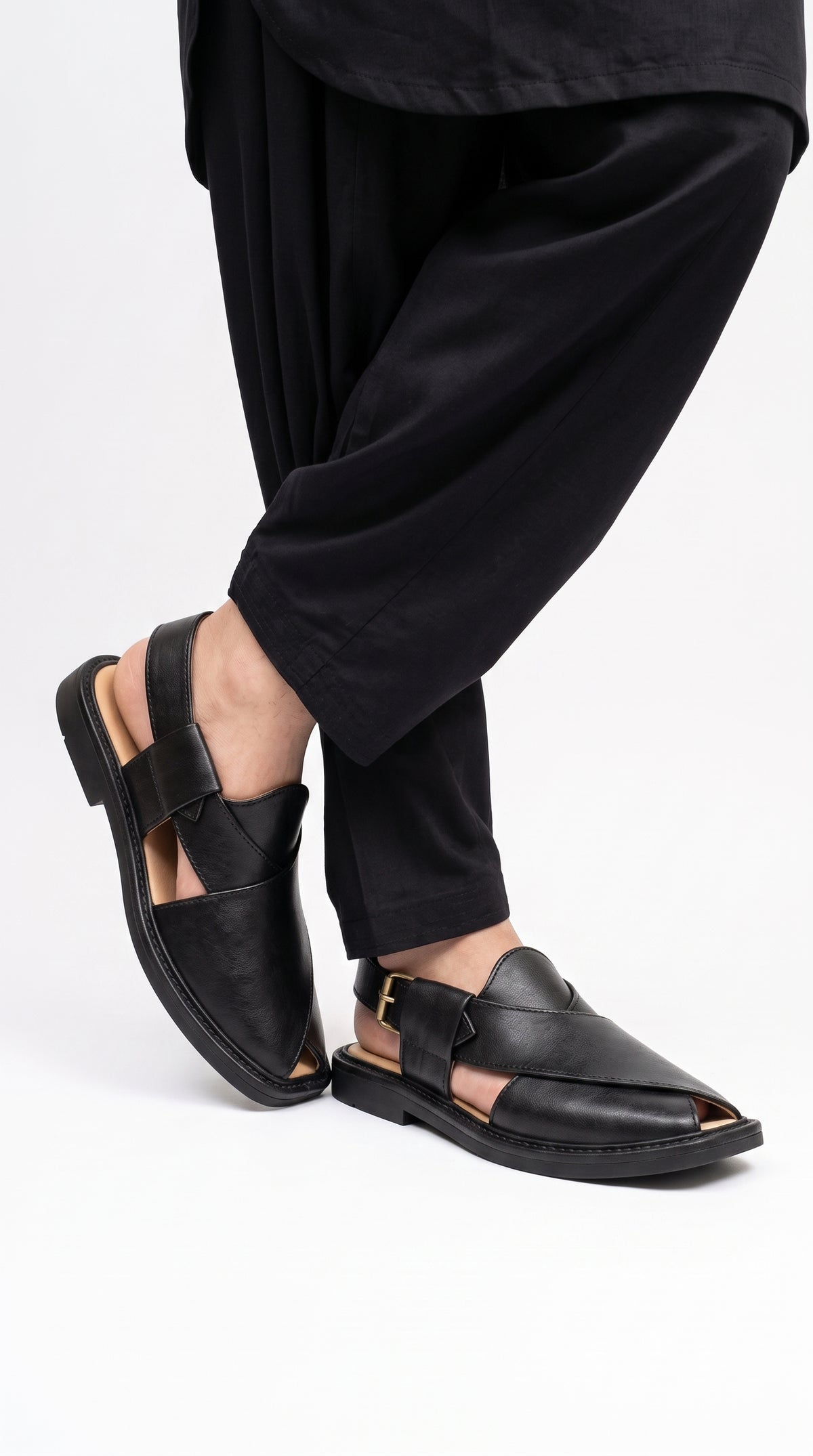 Men's Peshawri Sandal in shiny black leather - worn